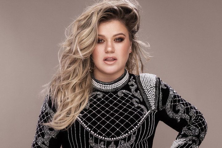People love to pit women in the music industry again each other, Kelly Clarkson told popular LGBTQ podcast Party Foul Radio with Pollo & Pearl.