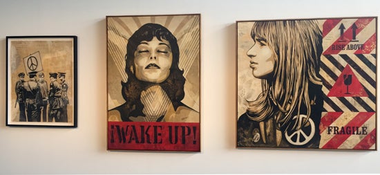 From right to left Shepard Fairey, Peaceful Protest (2017) mixed media (stencil, silkscreen, and collage) on paper 38h x 30w in (96.5 2h x 76.20w cm) $16,000; Shepard Fairey, Wake Up, (Edition 2/6) (2017) silkscreen on wood panel 24h x 18w in (60.96 x 45.72w cm); Shepard Fairey, Fragile Peace (2017) mixed media (stencil silkscreen and collage on canvas 56h x 54w in (142.24h x 137.16w cm) $60,000