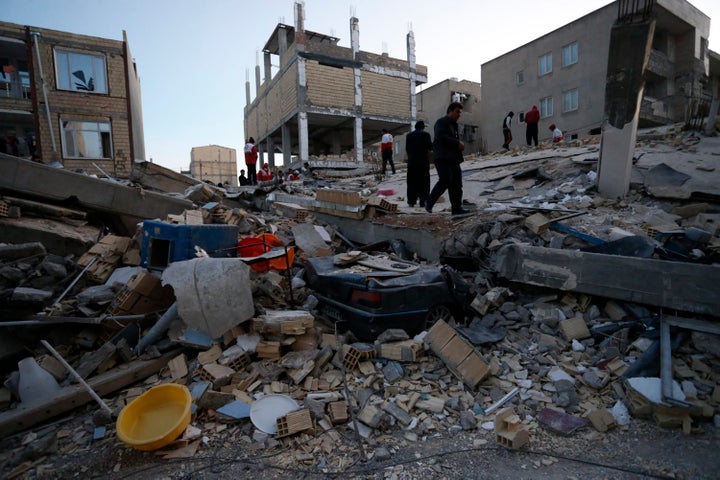 First responders search through the rubble in Iran's Kermanshah province following a 7.3-magnitude earthquake.