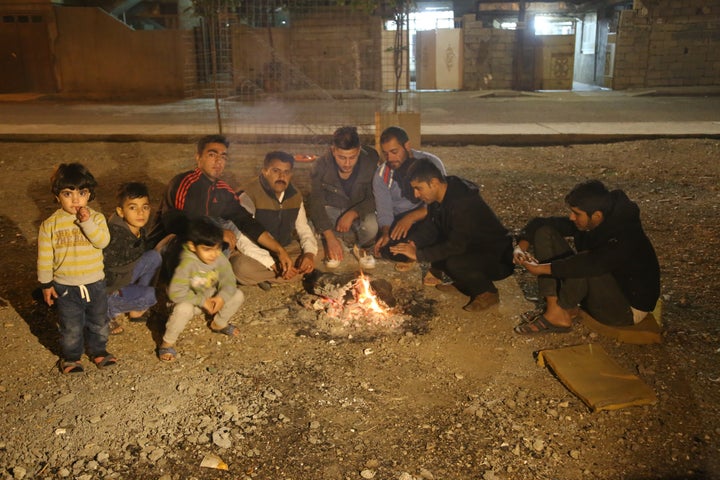 Quake survivors gathered on the street after fleeing from their homes and businesses.