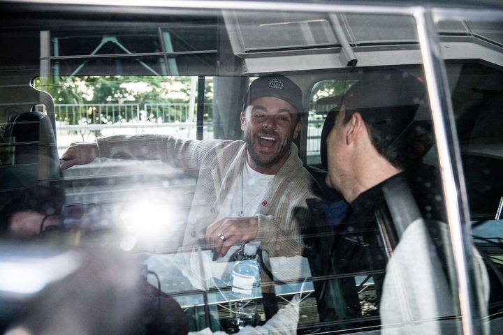 The duo laugh it up after arriving in Australia