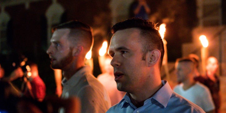 <p>Evan McLaren, executive director of the National Policy Institute, marching in he white supremacist march in Charlottesville , August 2017</p>