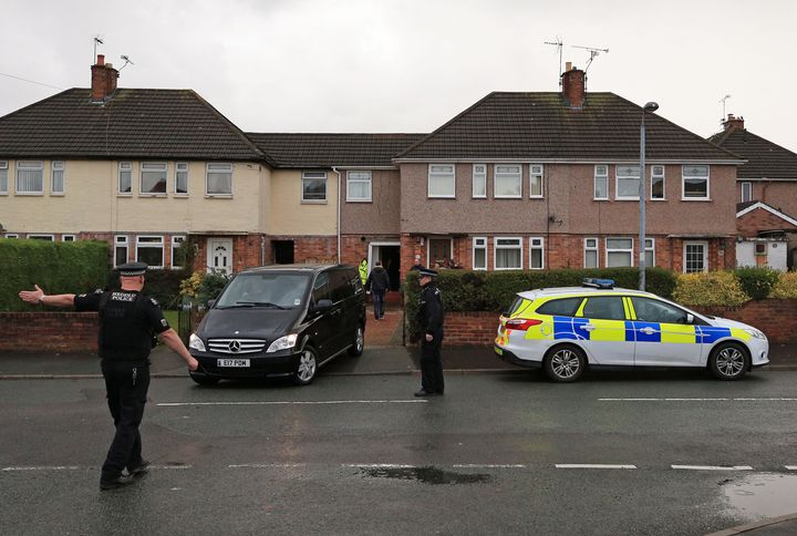 An ambulance and police outside Sargeant's the home (second right) in Connah Quay, north wales