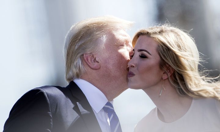 Donald Trump and his daughter Ivanka exchange a cheek kiss.