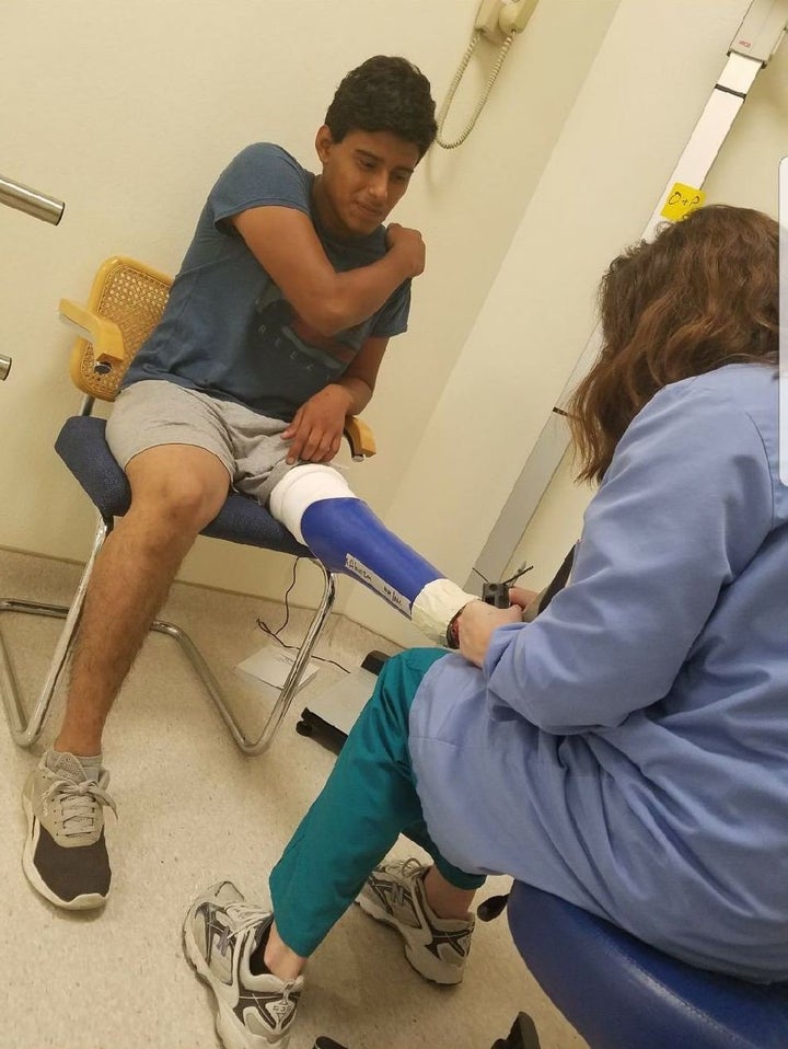 Felipe Abonza-Lopez receives assistance with his prosthetic leg in a photo taken prior to his detention.