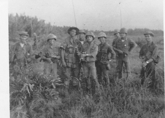 The tallest man for miles. Smallwood and team on patrol, 1969.