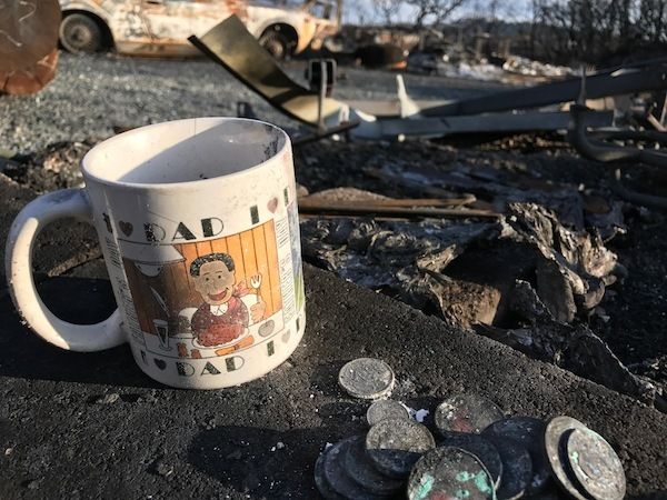Dad cup in the ashes of our house