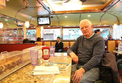 Hugh in his favorite seat at the end of the counter.