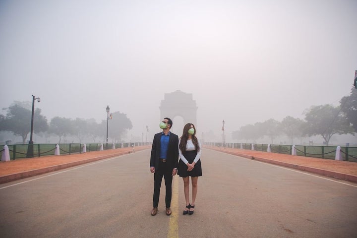 The couple in the smog-filled city. 