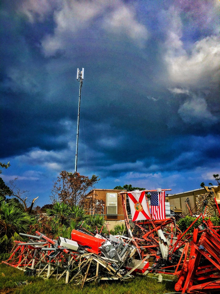 This cell tower on Marco Island, Florida was destroyed by Hurricane Irma. Despite the wind-swept damage, the equipment continued to process calls and data traffic for customers. In the background is the temporary cell tower the Network team set up to handle customer traffic before the permanent site was completed.