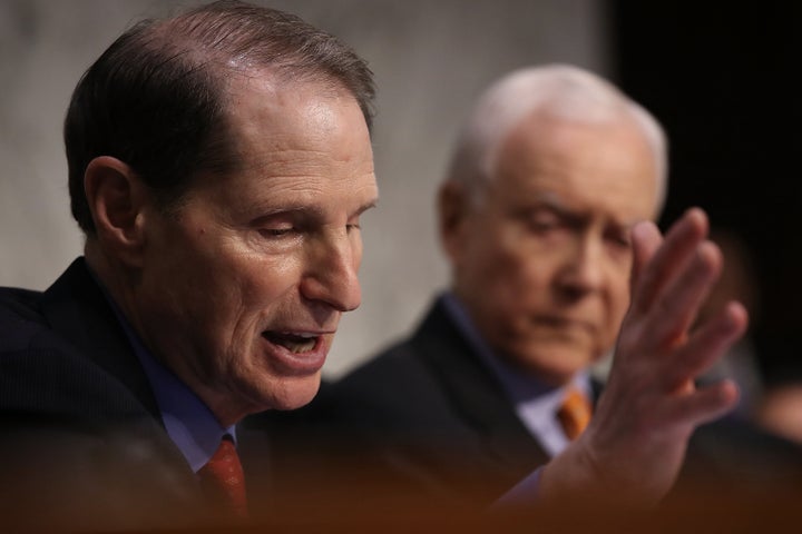 Sen. Ron Wyden (D-Ore.) speaks during a Senate Finance Committee session Tuesday on the GOP tax reform bill. Senate Republicans announced their intention to include a repeal of the Affordable Care Act's mandate for taxpayers to have health insurance in the tax bill.