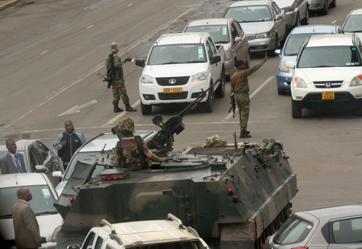 Military vehicles and soldiers on patrol