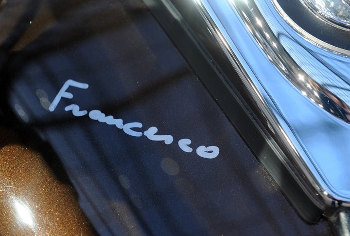 Pope Francis signed the tank of the motorcycle.