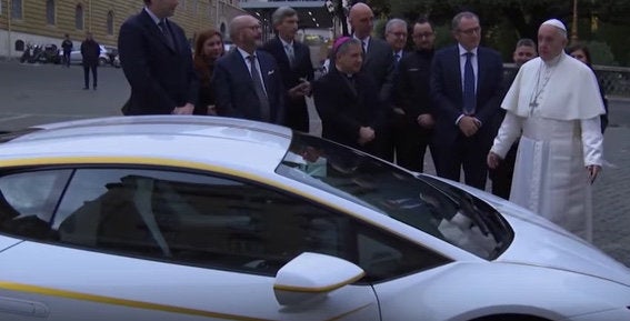 Pope Francis with his new special-edition Lamborghini Huracan.
