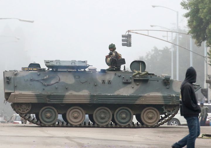 Military vehicles and soldiers patrol the streets in Harare on Nov. 15.