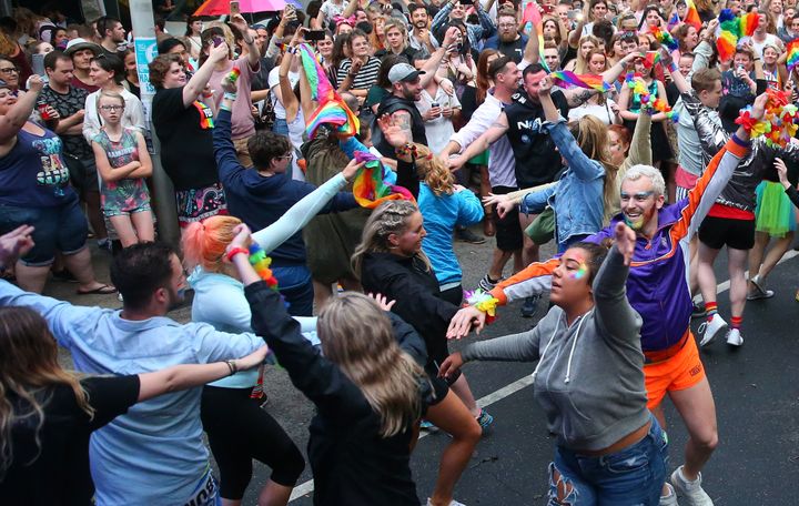 A 'flash mob' performs at a street party in Melbourne.