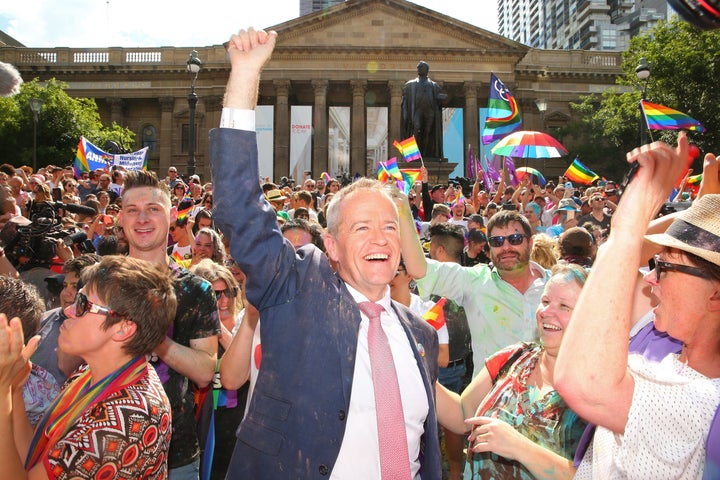 The leader of Australia's Labor Party, Bill Shorten, joins the cheering at the state library as the results of the nationwide poll on legalizing same-sex marriage are announced.