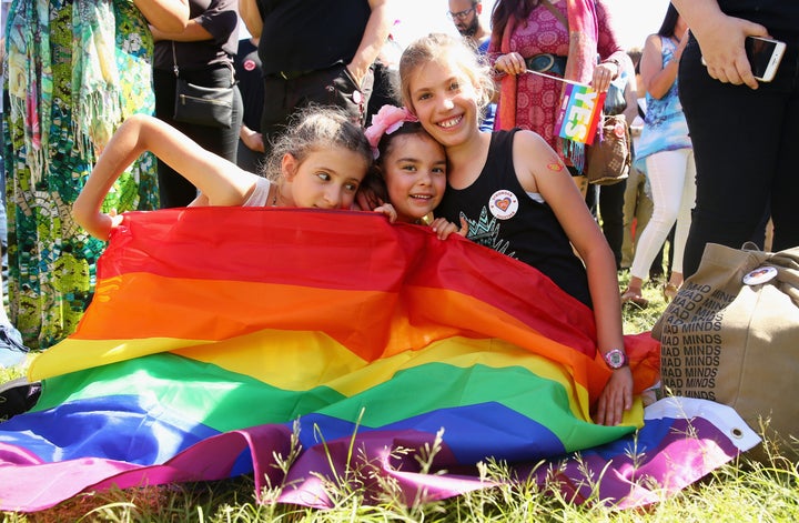 Cousins Hope Voigt, Mathilda Bowman and Rory Voigt are part of the crowd in Sydney.