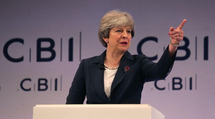 Theresa May addresses delegates at the annual Confederation of British Industry (CBI) conference in east London, on November 6, 2017. 