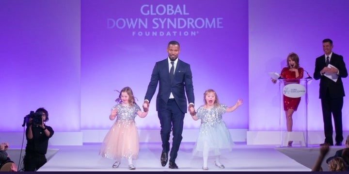 <p>Jamie Foxx and self advocate models</p>