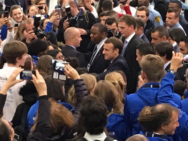 President Emmanuel Macron greeting COP23 volunteers