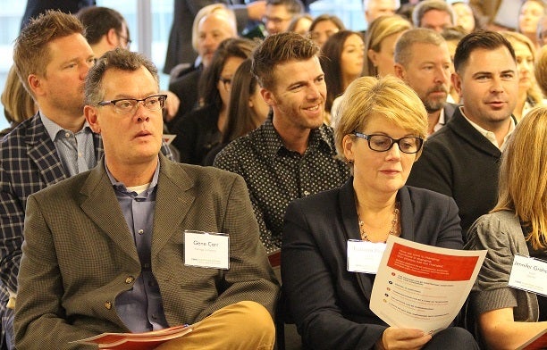 <p>Chicago 2.0 attendees review handouts.</p>