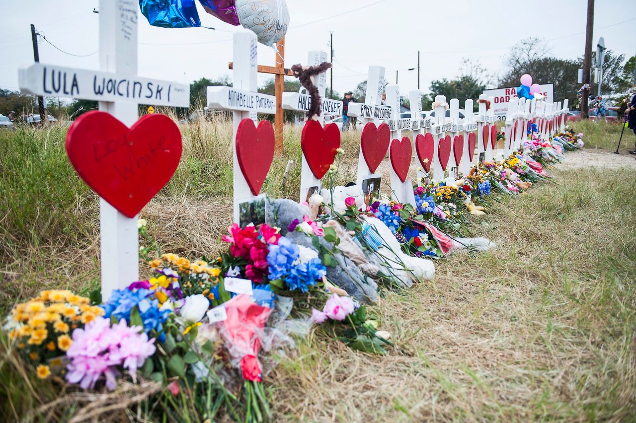 A memorial draws tributes to the victims of the mass shooting at First Baptist Church in Sutherland Springs, Texas, on Friday.
