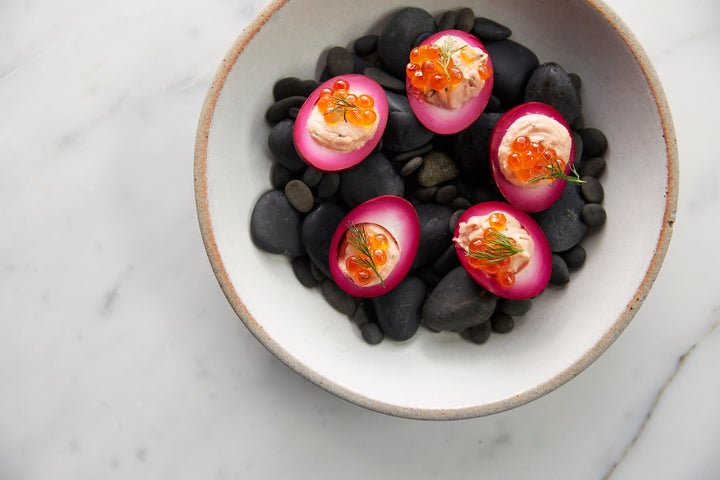 Deviled ranch eggs pickled with beets and topped with smoked salmon roe.
