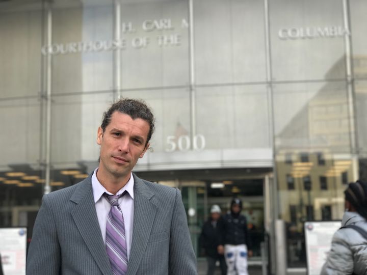 Alexei Wood stands outside D.C. Superior Court.