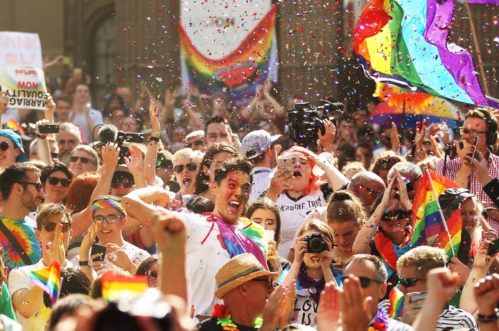 People in Melbourne celebrate the results of the national survey.