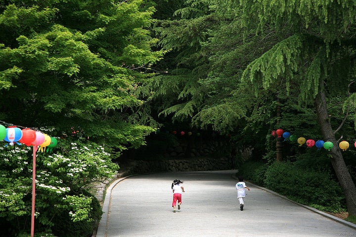 <p>Children on Grounds of a Korean Temple</p>