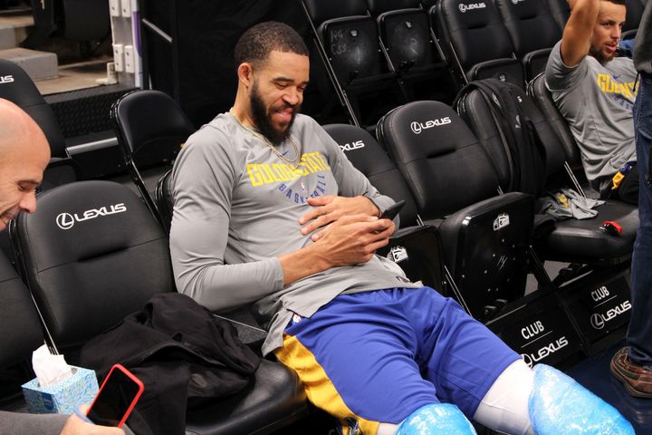 <p>Golden State Warriors center JaVale McGee laughs with Vice President of Communications Raymond Ridder while Stephen Curry answers media questions in the background.</p>