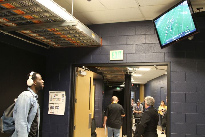 Draymond Green watches his alma mater Michigan State University win in the closing minutes prior to getting dressed for the game. 