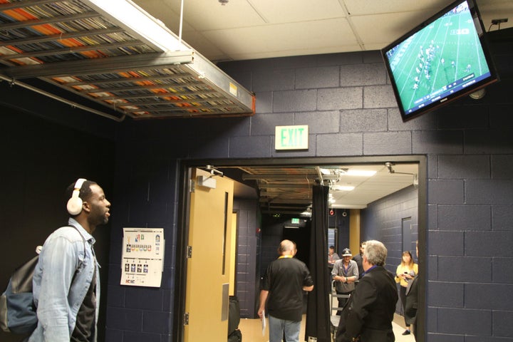 Draymond Green watches his alma mater Michigan State University win in the closing minutes prior to getting dressed for the game.