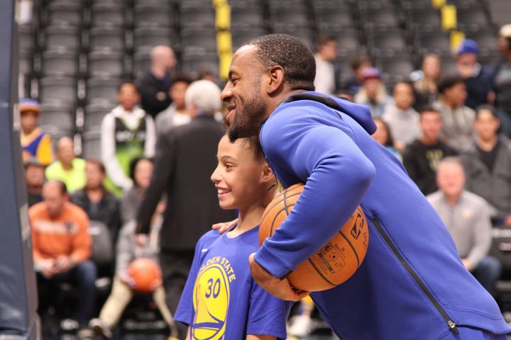 Golden State Warriors forward, and 2015 NBA Finals MVP, Andre Igoudala took a quick pause from pregame warmups to pose with a fan who was celebrating her birthday.