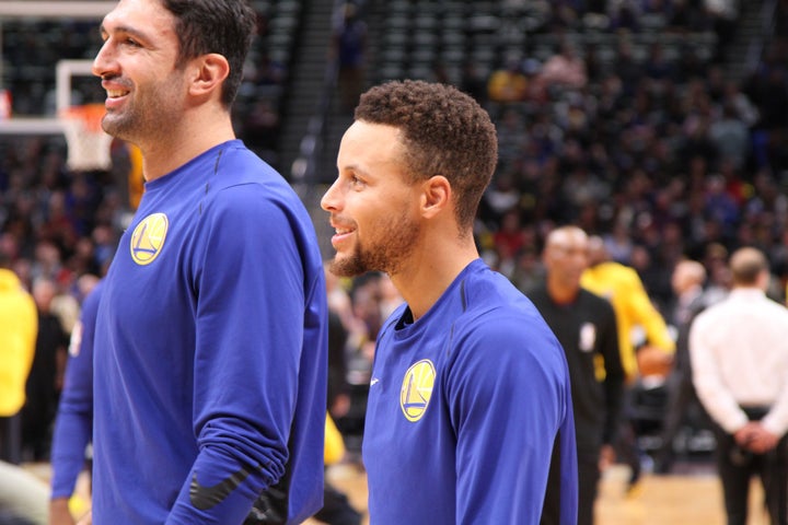 Stephen Curry and Golden State Warriors starting center Zaza Pachulia during pregame warmups.