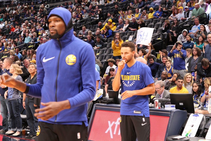 Golden State Warriors superstars Kevin Durant and Stephen Curry during pregame warmups.