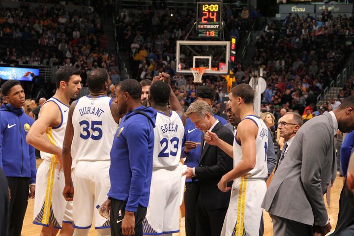 Draymond Green leads the Golden State Warriors prior to tip-off.