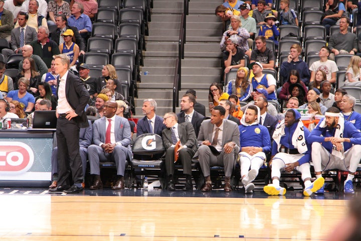 The Warriors bench near the conclusion of their 127-108 victory.