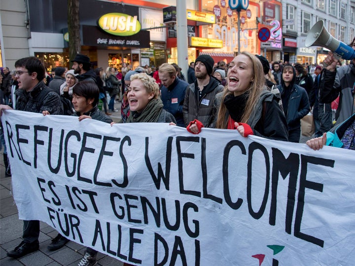 <p>Protestors in Austria showing their support for refugees.</p>