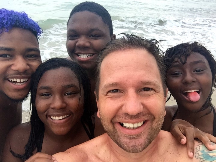 RaiseAChild’s Jason Cook and the youngest four of his nine children.