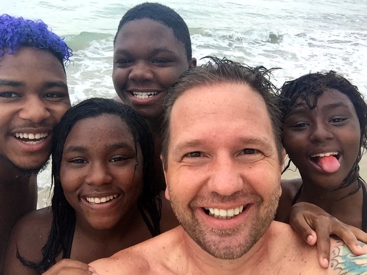  RaiseAChild’s Jason Cook and the youngest four of his nine children.