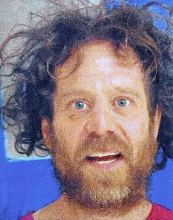 Kevin Neal, seen in a recent booking photo, had a history of domestic violence calls and a protective order against him by two female neighbors at the time of Tuesday's attack.