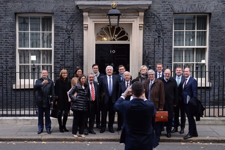 Business leaders from Europe and the UK pose for a group photo as they leave 10 Downing Street, London, after a meeting with Prime Minister Theresa May to discuss the future of UK-EU trade post-Brexit.