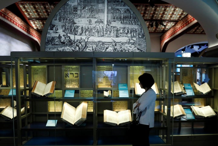 A visitor looks at various Bibles during a preview at the Museum of the Bible on Nov. 14.