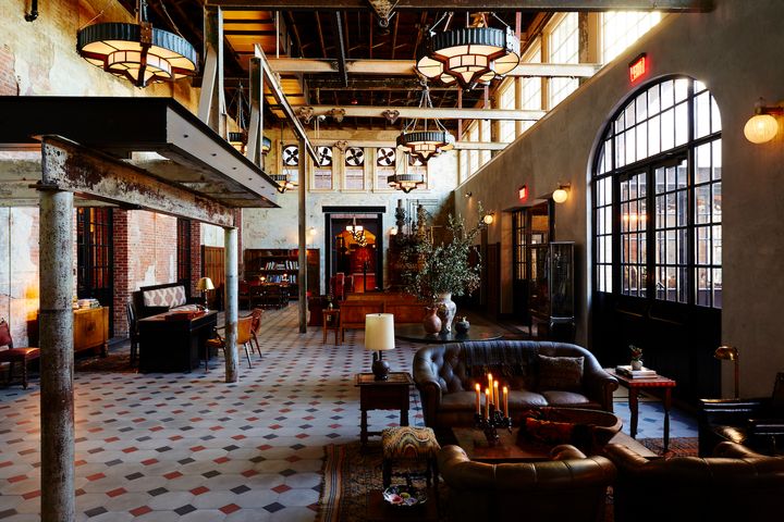 <p>Hotel Emma lobby featuring original walls, tiles, and custom furnishings.</p>