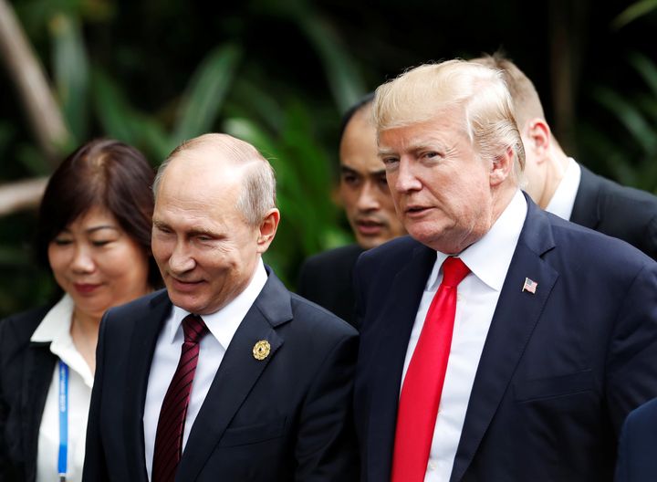 President Donald Trump and Russia's President Vladimir Putin attend a photo session at a summit in Vietnam on Saturday.