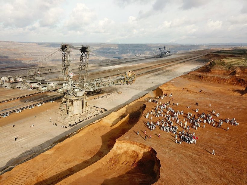 “Ende Gelande” protestors look over Germany’s largest open pit coal mine as police guard the diggers.