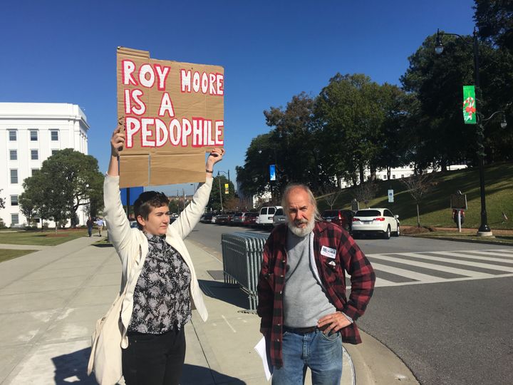 Tim Hensley, at right, argues with a protester at the Roy Moore event on Friday.