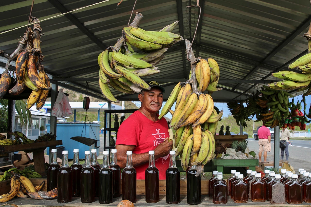 René “Papo” Cruz looks out from his fruit and vegetable stand in Hatillo, Puerto Rico, on Oct. 16.